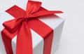 White gift box red ribbon Royalty Free Stock Photo