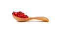 Wooden scoop spoon full of pink peppercorns Royalty Free Stock Photo