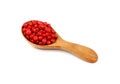 Wooden scoop spoon full of pink peppercorns Royalty Free Stock Photo