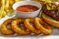 Onion rings and tomatoe sauce in little plate