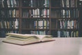 Close up of open book on desk with vintage filter blur background Royalty Free Stock Photo