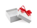 open empty grey gift box with red ribbon bow wrapped around lid isolated on white background Royalty Free Stock Photo