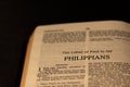 Close up of open Holy Bible Book on Philippians Epistle Letter from New Testament gospel