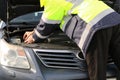 Close - Motor repair. Locksmith in a working jacket