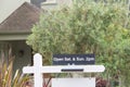 Close up of Open House sign in front of house for sale