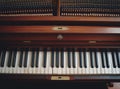 Close-up of an open piano, showcasing its keys and internal strings, evoking a sense of music and artistry. Royalty Free Stock Photo