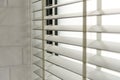 Close-up open venetian blinds. lighting range control sunlight coming from a window. decoration interior. Royalty Free Stock Photo