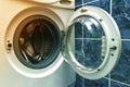 A close up of open washing machine in bathroom Royalty Free Stock Photo