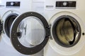 A close up of open washing machine in bathroom Royalty Free Stock Photo