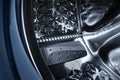 Close-up of open a washing machine drum. Preparing for washing Royalty Free Stock Photo