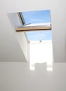 Close-up of open wooden skylight window in the house room. Open attic skylight window indoor