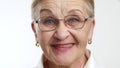 Close up of optimistic pretty elegant senior lady in glasses, smiling, laughing