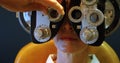 Optometrist examining patient eyes with messbrille 4k