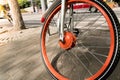 Close up the orange bicycle wheel and tire Royalty Free Stock Photo