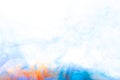 Close up of orange and blue ink in water with copy space on white background Royalty Free Stock Photo