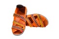 Close up of orange color elastic shoes isolated