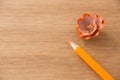 Close-up of orange color pencil with pencil shaving Royalty Free Stock Photo