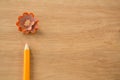 Close-up of orange color pencil with pencil shaving Royalty Free Stock Photo
