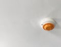 Smoke detector on a white ceiling Royalty Free Stock Photo