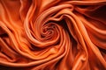 a close up of an orange fabric with a very large spiral design on it\'s center and a very thin line on the bottom of the