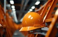 Close up of an orange hard hat placed on a pipe, construction picture