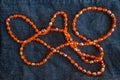Close up orange plastic bead necklace Royalty Free Stock Photo