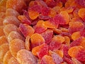 A close-up of orange and red gummy candies in the shape of hearts, covered in sugar crystals Royalty Free Stock Photo