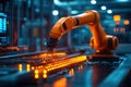 Close-up of an orange robotic arm assembling electronic components with glowing orange lights. electronics manufacturing Royalty Free Stock Photo