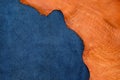 Close up orange rough edge and navy blue leather divide in two s