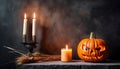 Close up of an orange scary carved pumpkin with candles