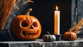 Close up of an orange scary carved pumpkin with candles