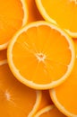 close up orange slice with some yellow slices on the side, in the style of feralcore