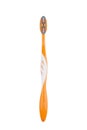 Close up of orange tooth brush isolated on white background Royalty Free Stock Photo