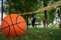 Close-up of a basketball on the grass in the park Royalty Free Stock Photo