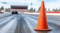 Close-up of orange traffic cone on asphalt racing track Royalty Free Stock Photo