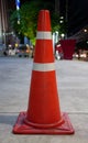 Orange traffic cone on blurred background Royalty Free Stock Photo