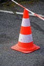 Close-up on an orange white traffic cone red-white caution Royalty Free Stock Photo