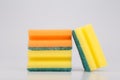 Orange and yellow sponge for cleaning and dish washing on white background Royalty Free Stock Photo