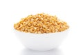 Close-up of Organic Bengal Gram Cicer arietinum or split yellow chana dal inside a ceramic white bowl