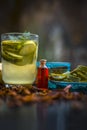 Close up of organic face pack of cucumber with aloe vera gel and rose oil on wooden surface in a glass container for Sunburns and Royalty Free Stock Photo