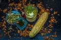 Close up of organic face pack of cucumber with aloe vera gel and rose oil on wooden surface in a glass container for Sunburns and Royalty Free Stock Photo