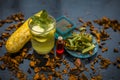 Close up of organic face pack of cucumber with aloe vera gel and rose oil on wooden surface in a glass container for Sunburns and Royalty Free Stock Photo