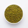 Close up of Organic green Gram Vigna radiata or whole green moong dal on a ceramic white bowl.