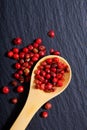 Close up Organic Pink Peppercorn in wooden spoon Royalty Free Stock Photo