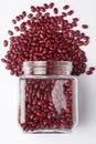 Close up of Organic Rajma, Laal Lobia or red kidney beans dal spilled and in a glass jar.