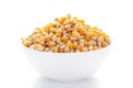 Close up organic yellow corn seed or maize Zea mays inside a white ceramic bowl