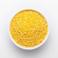 Close up of Organic yellow Gram Vigna radiata or split yellow moong dal on a ceramic white bowl.