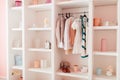 Close-up of organized wardrobe with clothes and accessories