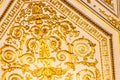 Close-up of ornate gilded golden ceiling