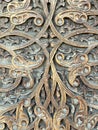 Close up of ornately carved wooden door of mosque, Bukhara, Uzbekistan